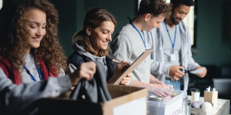 group-of-volunteers-working-in-community-charity-donation-center-1.jpg group-of-volunteers-working-in-community-charity-donation-center-1.jpg